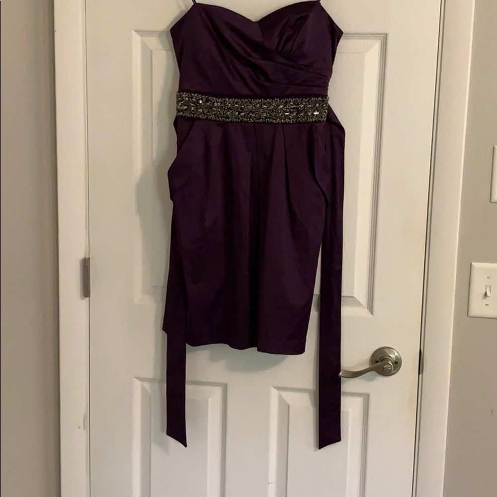 Purple strapless evening mini dress.